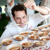 Jason Weiner of Almond Restaurant creating appetizers at a tasting event on VerTerra Dinnerware 3.5 Inch round bowls