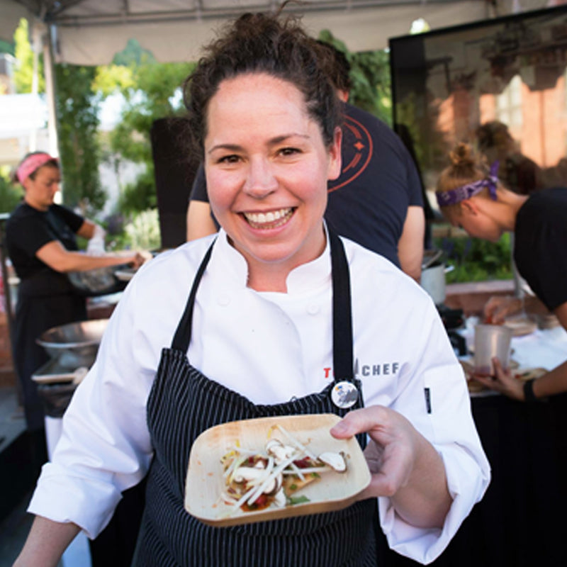 Top Chef winner Stephanie Izard serving a dish on VerTerra Dinnerware's 6 Inch Palm Leaf (Bamboo) Plate.